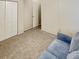 Comfortable bedroom with carpet, closet, and open doorway at 7148 E Bank Dr # 7148, Tampa, FL 33617