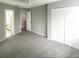 Spacious bedroom with large closet, gray paint, and carpet floors at 7148 E Bank Dr # 7148, Tampa, FL 33617