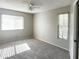 Cozy bedroom with carpet flooring and windows to let in natural light at 7148 E Bank Dr # 7148, Tampa, FL 33617