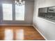 Dining Room with wood floors and view to kitchen pass through at 7148 E Bank Dr # 7148, Tampa, FL 33617
