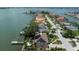 Waterfront home with a private dock and solar panels on the roof at 8 Sunset Bay Dr, Belleair, FL 33756