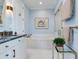 Elegant bathroom featuring bathtub, stylish fixtures, and decorative plant at 8 Sunset Bay Dr, Belleair, FL 33756