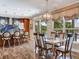 Bright dining room with a chandelier, beautiful floors and water views at 8 Sunset Bay Dr, Belleair, FL 33756