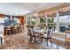 Dining area with a large window, views, and seating for six at 8 Sunset Bay Dr, Belleair, FL 33756