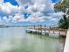 Private dock with boat lift providing easy access to the water at 8 Sunset Bay Dr, Belleair, FL 33756
