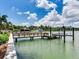 Private dock with boat lift overlooking the calm bay waters at 8 Sunset Bay Dr, Belleair, FL 33756