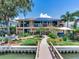 Two-story home with backyard landscaping and private dock access at 8 Sunset Bay Dr, Belleair, FL 33756