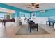 Spacious game room featuring a pool table, bar area, and comfortable seating at 8 Sunset Bay Dr, Belleair, FL 33756