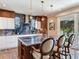 Gourmet kitchen with large island, modern lighting, and designer finishes at 8 Sunset Bay Dr, Belleair, FL 33756