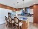 Spacious kitchen with modern appliances, large island, and barstool seating at 8 Sunset Bay Dr, Belleair, FL 33756