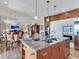 Open kitchen with a view to the dining and living area at 8 Sunset Bay Dr, Belleair, FL 33756