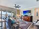 Spacious living room with comfortable seating, rug, and ceiling fan at 8 Sunset Bay Dr, Belleair, FL 33756
