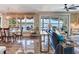 Living room with views of the water and a dining room area at 8 Sunset Bay Dr, Belleair, FL 33756