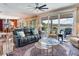 Living room connected to the dining and kitchen area with water views at 8 Sunset Bay Dr, Belleair, FL 33756