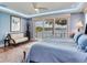 Bright and airy main bedroom featuring scenic water views and elegant decor for a relaxing atmosphere at 8 Sunset Bay Dr, Belleair, FL 33756