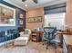 Comfortable home office with a large window, desk, chair, and a cozy reading nook at 8 Sunset Bay Dr, Belleair, FL 33756