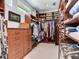 Spacious walk-in closet with custom shelving and ample storage space at 8 Sunset Bay Dr, Belleair, FL 33756