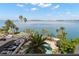 Aerial view featuring a complex pool and waterfront with views of bay waters and city landscape at 80 Rogers St # 3A, Clearwater, FL 33756