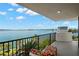 Condo balcony featuring stunning waterfront views and a clear, sunny sky at 80 Rogers St # 3A, Clearwater, FL 33756