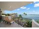 Balcony view overlooking parking, tropical landscaping, bay waters and city scape at 80 Rogers St # 3A, Clearwater, FL 33756