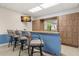 Community clubhouse bar area with barstool seating at 80 Rogers St # 3A, Clearwater, FL 33756