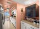 Updated kitchen with white cabinets, stainless steel appliances, and views of the water at 80 Rogers St # 3A, Clearwater, FL 33756