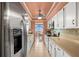 Well-maintained kitchen with white cabinets, stainless steel appliances, and water views at 80 Rogers St # 3A, Clearwater, FL 33756