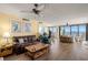 Inviting living room with water views, wood floors, comfortable seating, and a ceiling fan at 80 Rogers St # 3A, Clearwater, FL 33756