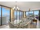 Bright living room with water views, a chandelier, and stylish seating arrangements at 80 Rogers St # 3A, Clearwater, FL 33756
