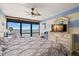 Spacious main bedroom with a large bed, dresser, waterfront view, and plenty of natural light at 80 Rogers St # 3A, Clearwater, FL 33756