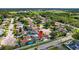 Aerial view highlighting a charming home with a private pool, nestled in a quiet residential neighborhood and mature trees at 8005 Pepperidge Ln, Port Richey, FL 34668
