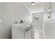 Laundry room area featuring a washer, dryer, and tiled flooring at 8005 Pepperidge Ln, Port Richey, FL 34668