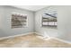Bright room with tiled floors, corner windows, and baseboard trim at 8005 Pepperidge Ln, Port Richey, FL 34668