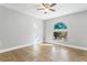 Empty room featuring tile floors and a colorful stained glass window at 8005 Pepperidge Ln, Port Richey, FL 34668