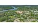 A picturesque aerial view of a community near a river, highlighting nearby development and green spaces at 8502 N Hyaleah Rd, Tampa, FL 33617