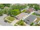 Charming single-Gathering home with a well-manicured lawn and a two-car garage, as seen from an aerial view at 8502 N Hyaleah Rd, Tampa, FL 33617