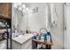 Bathroom featuring a vanity, open shelving, and large mirror at 8502 N Hyaleah Rd, Tampa, FL 33617