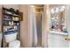 Cozy bathroom features a vanity with storage, walk-in shower, and open shelving at 8502 N Hyaleah Rd, Tampa, FL 33617