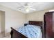 Bedroom with ceiling fan, white walls and tiled floor at 8502 N Hyaleah Rd, Tampa, FL 33617