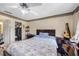 Comfortable bedroom, offering a closet for storage and a ceiling fan at 8502 N Hyaleah Rd, Tampa, FL 33617