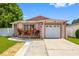 Charming single-story home featuring a one-car garage and lush landscaping at 8502 N Hyaleah Rd, Tampa, FL 33617