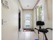 Bright hallway with tile flooring leading to the main areas of the house at 8502 N Hyaleah Rd, Tampa, FL 33617