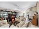 Spacious living room with tile flooring and views into the dining area at 8502 N Hyaleah Rd, Tampa, FL 33617