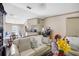 Inviting living room with comfortable seating and an open view into the adjacent dining area at 8502 N Hyaleah Rd, Tampa, FL 33617