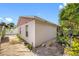 Rear exterior view of the house, revealing its simple design and spacious lot at 8502 N Hyaleah Rd, Tampa, FL 33617