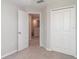 Bedroom features a closet and doorway leading into the hallway at 9741 Mulberry Marsh Ln, Sun City Center, FL 33573