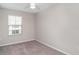 Bedroom featuring neutral carpet and a large window at 9741 Mulberry Marsh Ln, Sun City Center, FL 33573
