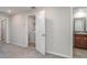 Bedroom doorway to the laundry room and bathroom at 9741 Mulberry Marsh Ln, Sun City Center, FL 33573