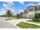 Beautiful townhome with a large driveway, attached garage and landscaping at 9741 Mulberry Marsh Ln, Sun City Center, FL 33573