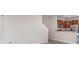 Open living space showing the kitchen, tile floors and stairwell to the upper level at 9741 Mulberry Marsh Ln, Sun City Center, FL 33573